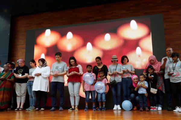 Family members hold candles during the fourth annual remembrance event for the missing Malaysia Airlines flight MH370, in Kuala Lumpur, Malaysia March 3, 2018. (Reuters/Lai Seng Sin)