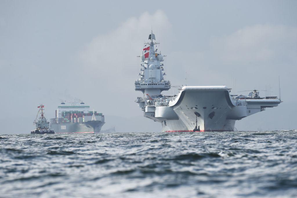 China's Liaoning (R), arrives in Hong Kong waters on July 7, 2017. (Anthony Wallace/AFP/Getty Images)