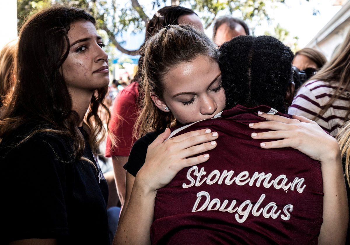 Students from Marjory Stoneman Douglas High School attend a memorial following a school shooting incident in Parkland, Florida, U.S., Feb. 15, 2018. (Reuters/Thom Baur/File Photo)