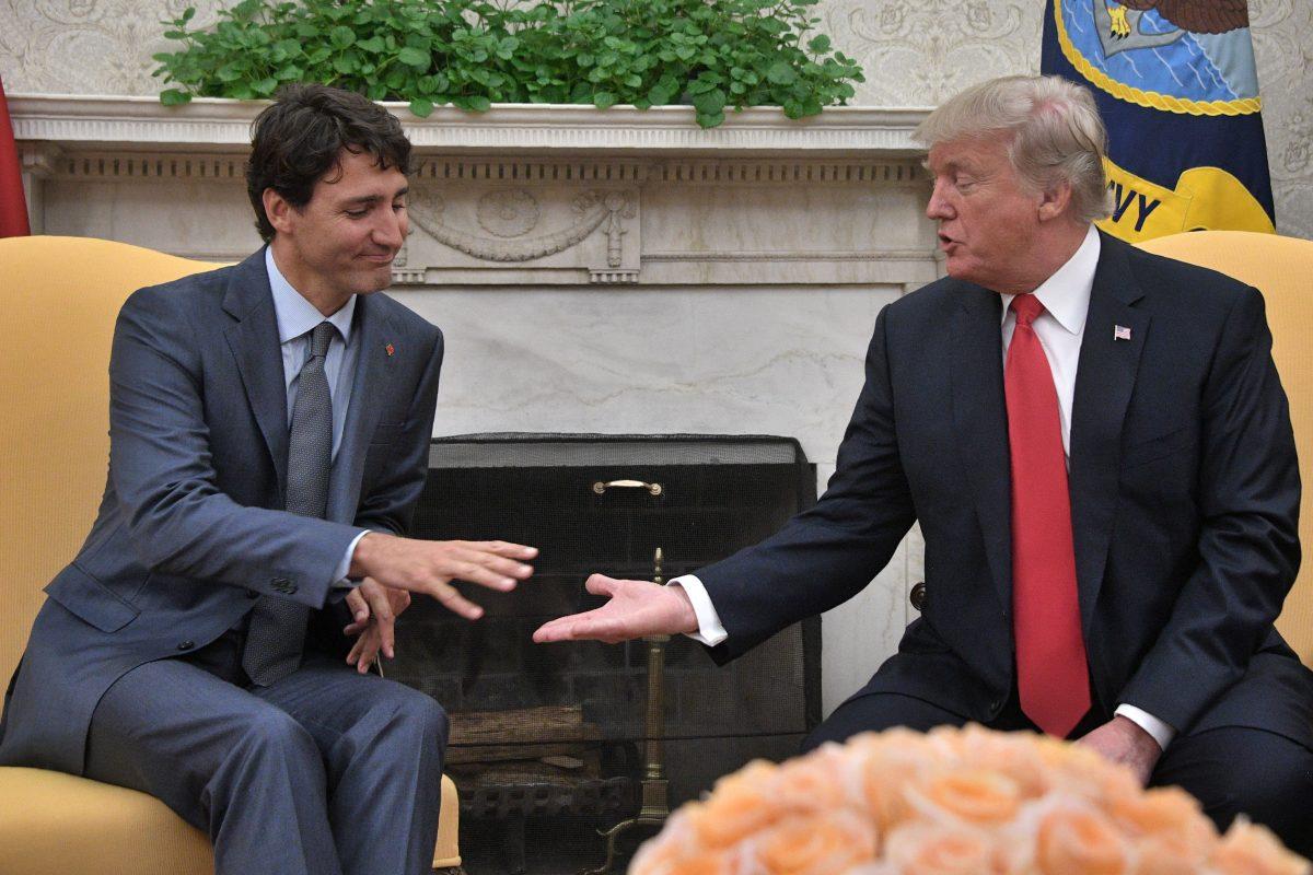 U.S. President Donald Trump shakes hands with Canadian Prime Minister Justin Trudeau during their meeting at the White House in Washington on Oct. 11, 2017. Canada was granted a temporary exemption from U.S. steel and aluminum tariffs at that time. (Jim Watson/AFP/Getty Images)