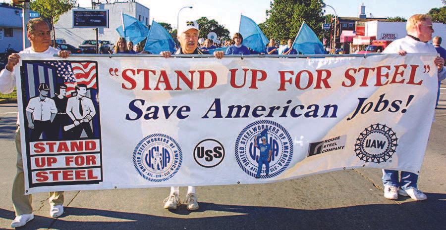 Michigan steelworkers rally to urge President George W. Bush to defend manufacturing jobs by keeping steel tariffs in place in River Rouge, Mich., on Sept. 20, 2003. (BILL PUGLIANO/GETTY IMAGES)