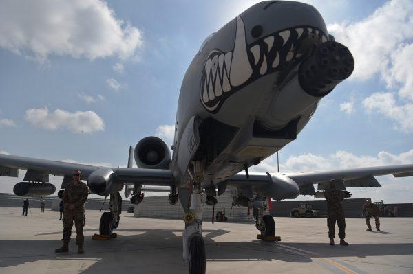 U.S. soldiers stand alongside an A-10 Thunderbolt II at Kandahar Air base in Afghanistan on January 23, 2018. (Shah Marai/AFP/Getty Images)