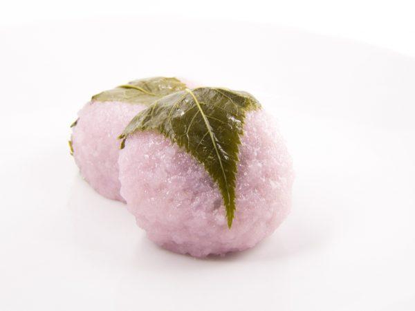 Sakura mochi, a sweet rice cake filled with red bean paste and wrapped in a pickled cherry blossom leaf, is a popular springtime sweet. (Aon168/Shutterstock)