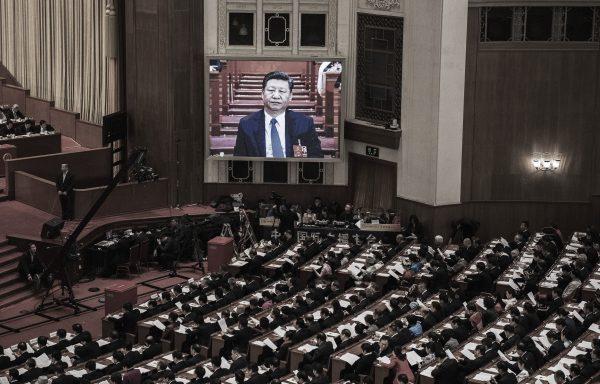 Chinese leader Xi Jinping is seen on a large screen over delegates as he joins a session of the rubber-stamp legislature at The Great Hall Of The People in Beijing, China, on March 11, 2018. (Kevin Frayer/Getty Images)