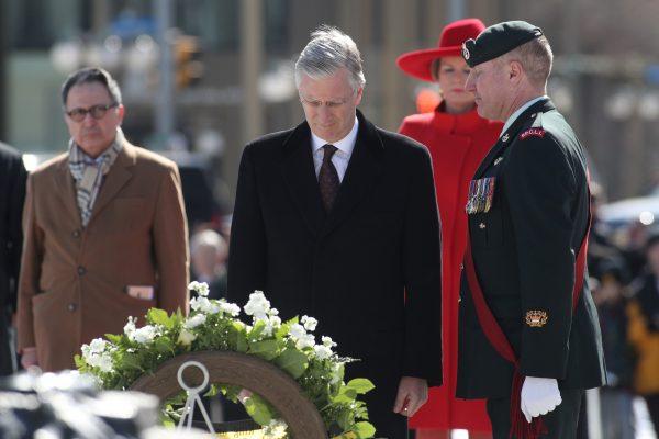 King Philippe and Queen Mathilde of Belgium stand after laying a wreath at the Tomb of the Unknown Soldier during their state visit to Canada, in Ottawa, on March 12, 2018. (Lars Hagberg/AFP/Getty Images)