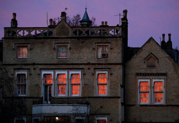 Dawn is reflected in the windows of the official residence of Russia's ambassador to Britain, in central London, March 14, 2018. (Reuters/Phil Noble)