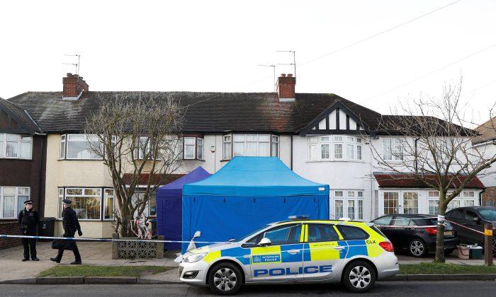 Police stand on duty outside the home of Nikolai Glushkov in New Malden, on the outskirts of London Britain, March 14, 2018. (Reuters/Peter Nicholls)