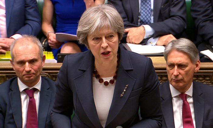 Britain's Prime Minister Theresa May addresses the House of Commons on her government's reaction to the poisoning of former Russian intelligence officer Sergei Skripal and his daughter Yulia in Salisbury, in London, March 14, 2018. (Parliament TV handout via Reuters)