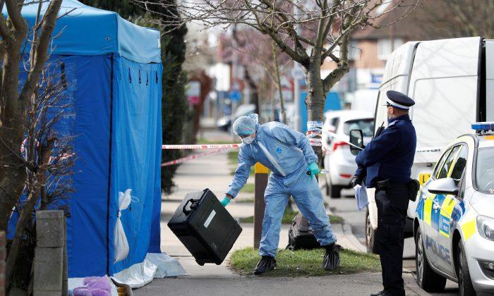 Forensics investigators work at the home of Nikolai Glushkov in New Malden, on the outskirts of London, Britain, March 14, 2018. (Reuters/Peter Nicholls)