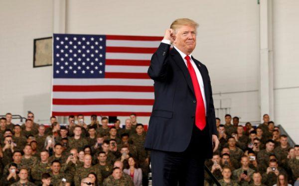 U.S. President Donald Trump pumps his fist after speaking at Marine Corps Air Station Miramar in San Diego, California, on March 13, 2018. (Kevin Lamarque/File Photo/Reuters)