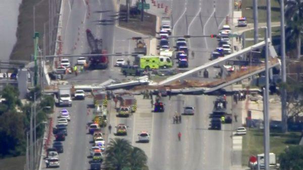 Emergency crews look for victims at the scene of a collapsed pedestrian bridge at Florida International University in Miami, Florida, on March 15, 2018. (WTVJ-NBCMiami.com via Reuters)