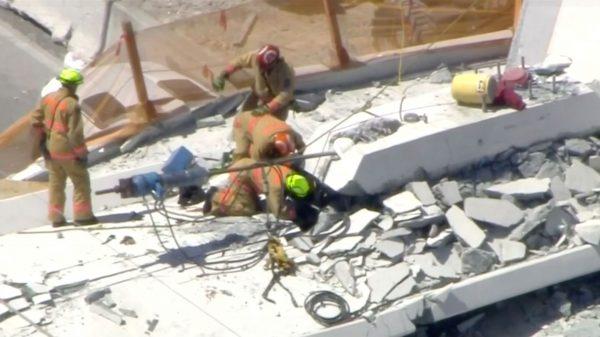 Emergency crews look for victims at the scene of a collapsed pedestrian bridge at Florida International University in Miami, Florida, on March 15, 2018. (WTVJ-NBCMiami.com via Reuters)