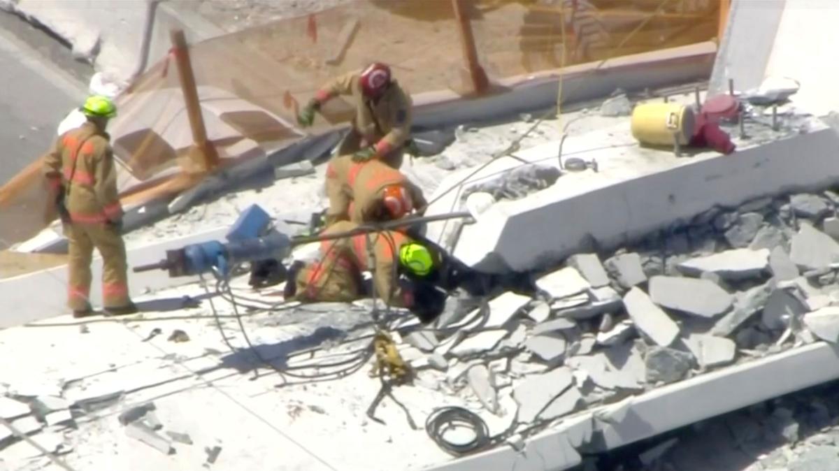 Emergency crews look for victims at the scene of a collapsed pedestrian bridge at Florida International University in Miami, on March 15, 2018. (WTVJ-NBCMiami.com via Reuters)