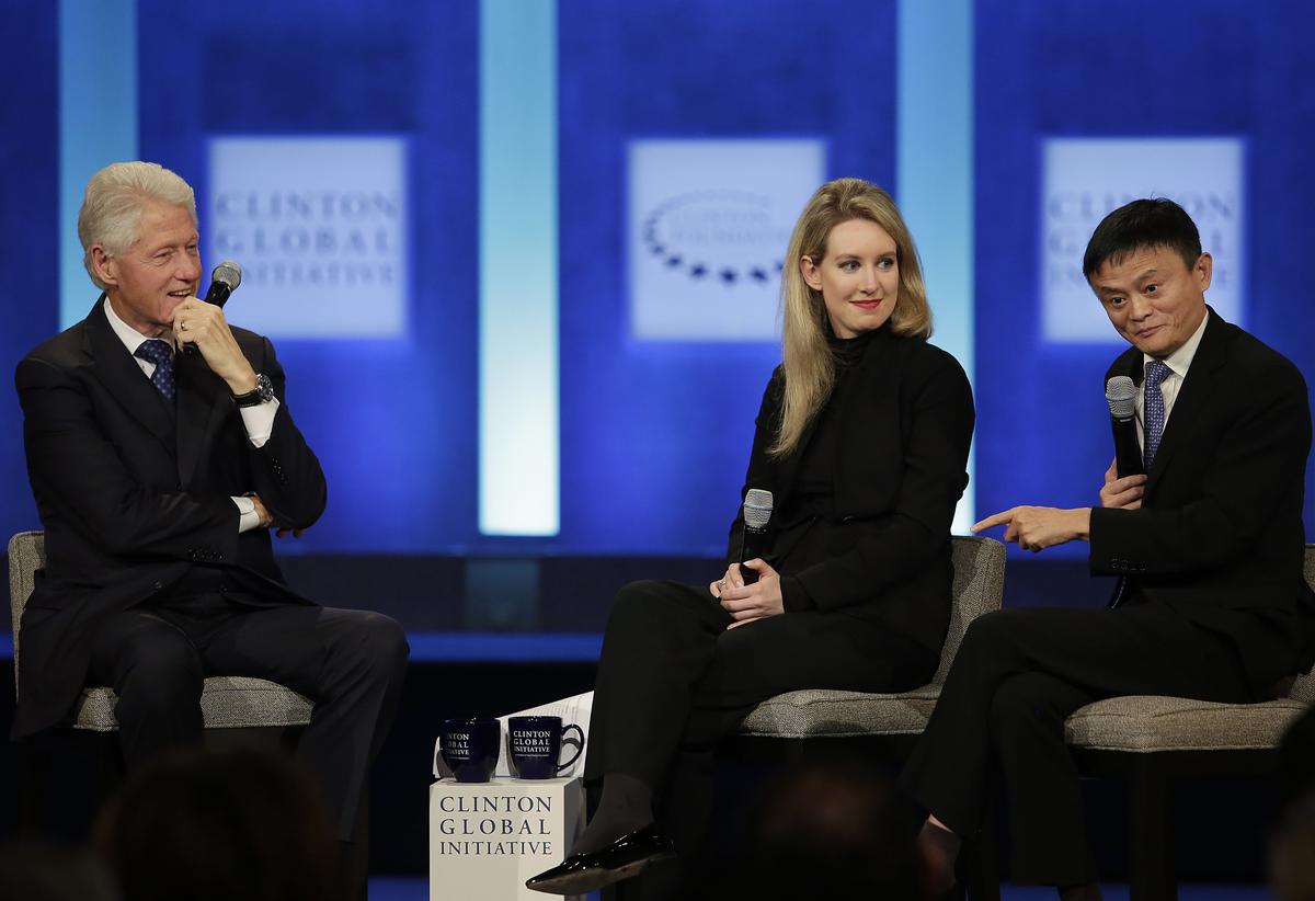 Former US President Bill Clinton (L) and Theranos Founder and CEO Elizabeth Holmes listen as Alibaba Group Executive Chairman Jack Ma (R) speaks during the Clinton Global Initiative annual meeting in New York on Sept. 29, 2015. (Joshua LOTT/AFP/Getty Images)