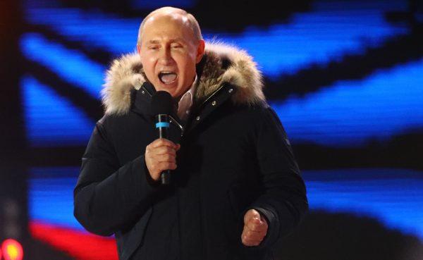 Russian President and Presidential candidate Vladimir Putin delivers a speech during a rally and concert marking the fourth anniversary of Russia's annexation of the Crimea region, at Manezhnaya Square in central Moscow, Russia March 18, 2018. (Reuters/David Mdzinarishvili)