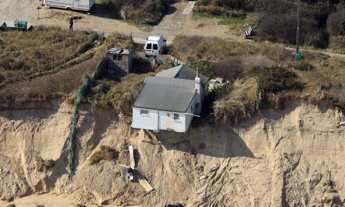 Jaw-Dropping Drone Footage Shows Homes Teetering on Cliff Edge After Storm Washes Ground Away