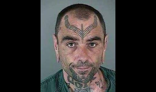 FBI Seeking Help Finding Fugitive With ‘Dork’ Tattoo on His Neck