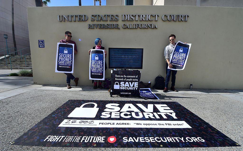 Protesters in front of the US District Court in Riverside, California, ahead of a legal tussle between Apple and the FBI after Apple's refusal to help the FBI unlock an attacker's iPhone. (Frederic J. Brown/AFP/Getty Images)