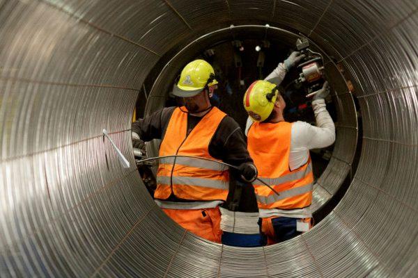 Workers work on pipes at the Nord Stream 2 facility in Sassnitz, Germany, on October 19, 2017 ( Carsten Koall/Getty Images)