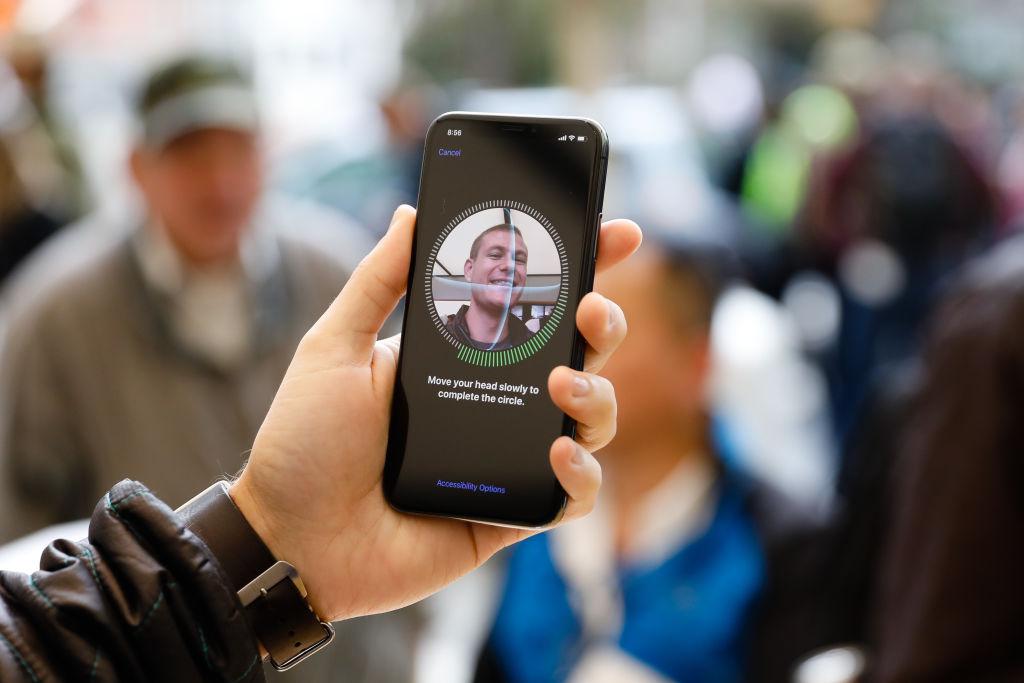 A customer sets up Face ID on his new iPhone X at the Apple Store Union Square in San Francisco, California, on Nov. 3, 2017. (Elijah Nouvellage/AFP/Getty Images)