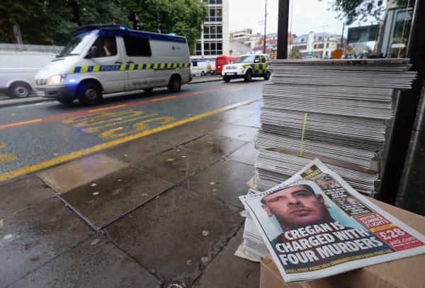 Newspapers are stacked for sale as Dale Cregan accused of four murders including two police officers leaves Manchester Magistrates Court in an armed convoy on September 21, 2012 in Manchester, England. (Photo by Christopher Furlong/Getty Images)