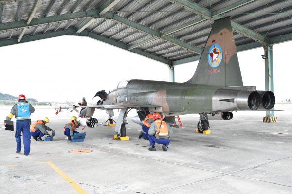 Soldiers check a F-5 dighter during an annual drill at an air base in Taitung City, southeast Taiwan on January 30, 2018. Taiwanese troops staged live-fire exercises January 30 to simulate fending off an attempted invasion. (Mandy Cheng/AFP/Getty Images)