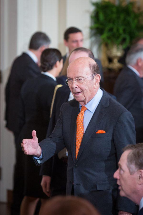 United States Secretary of Commerce Wilbur Ross greets other cabinet members at the East Room of the White House in Washington on Oct. 12, 2017. (Benjamin Chasteen/The Epoch Times)