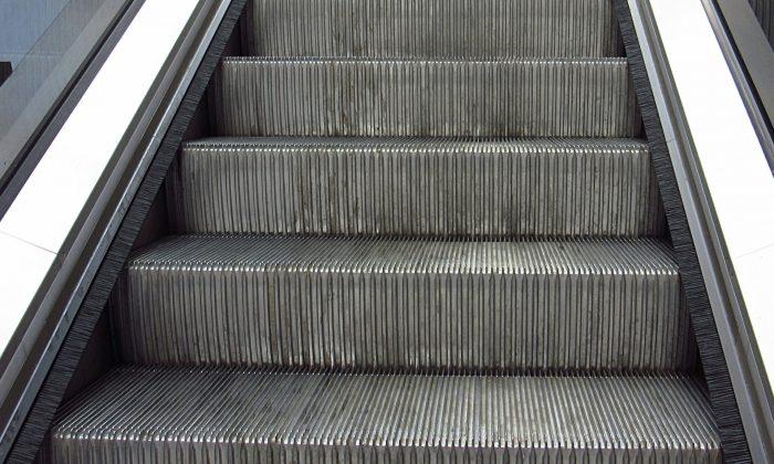 Man On Escalator Gets Swallowed By The Running Stairs