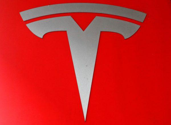 The company logo is seen in front of a showroom of U.S. car manufacturer Tesla in Zurich, Switzerland March 28, 2018. (Reuters/Arnd Wiegmann)