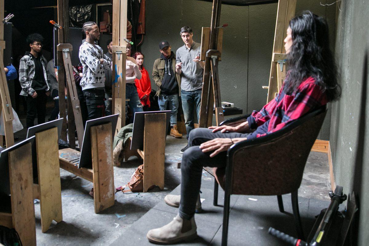 Edward Minoff holds a portrait drawing workshop for BAVPA high school students, as <span class="s1">Tenzing Wangchuk poses, </span>at Grand Central Atelier on March 9, 2018. (Milene Fernandez/The Epoch Times)