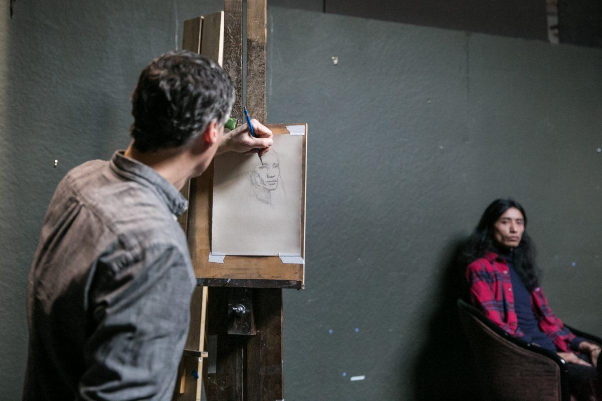 Edward Minoff gives a drawing demonstration to high school students from BAVPA, with <span class="s1">Tenzing Wangchuk posing, </span>at Grand Central Atelier on March 9, 2018. (Milene Fernandez/The Epoch Times)