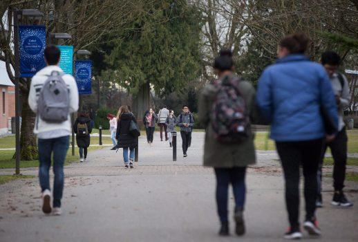 Students walk on campus at Trinity Western University in Langley, B.C. RBC advocates for 100 percent work-integrated learning. Gone are the days where universities can purely focus on theory. (The Canadian Press/Darryl Dyck)