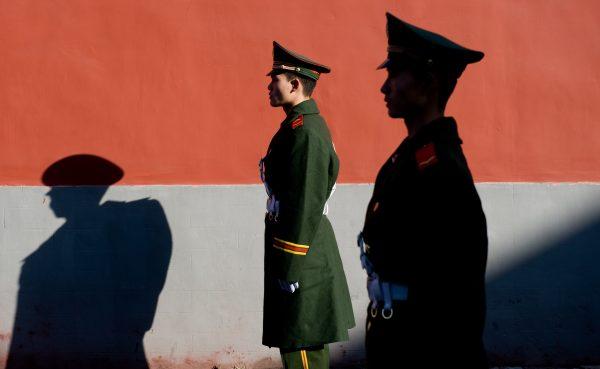 Members of the Chinese police stand guard in Beijing in a file photo. (Saul Loeb/AFP/Getty Images)