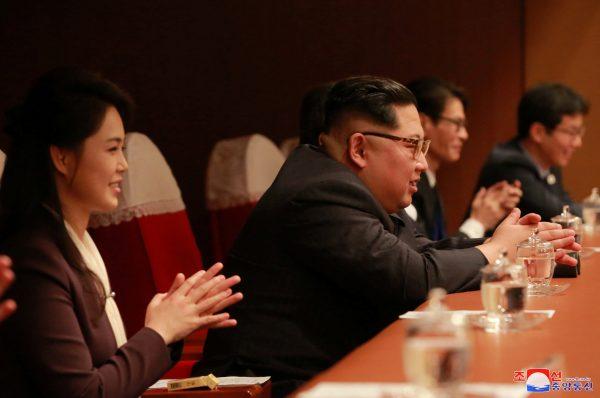North Korean leader Kim Jong Un and his wife Ri Sol Ju watch South Korean K-pop singers perform in a concert under the title "Spring is Coming" at the Pyongyang Taekwondo Hall in North Korea in this photo released by North Korea's Korean Central News Agency (KCNA) in Pyongyang April 2, 2018. (KCNA/via Reuters)