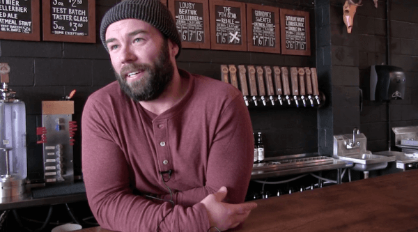 Tyler Birch, co-owner of the Barn Hammer Brewing Company. (Screenshot/The Canadian Press)