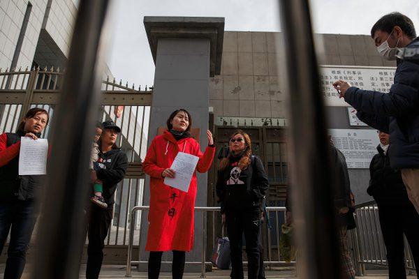Li Wenzu, wife of detained Chinese rights lawyer Wang Quanzhang, talks to reporters outside a Supreme People's Court complaints office in Beijing on April 4, 2018. (Reuters/Damir Sagolj)