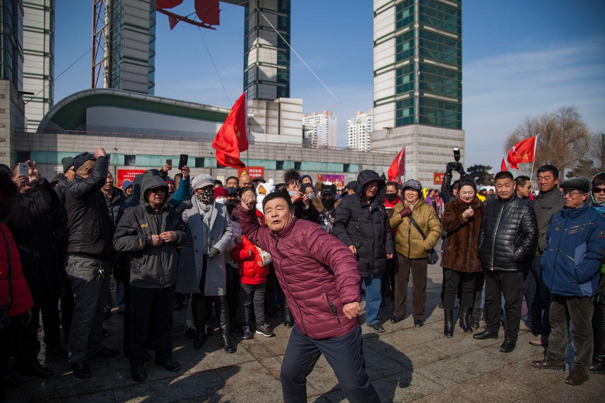 Residents call for a boycott of South Korean goods in China's northeast Jilin Province on March 5, 2017. (STR/AFP/Getty Images)