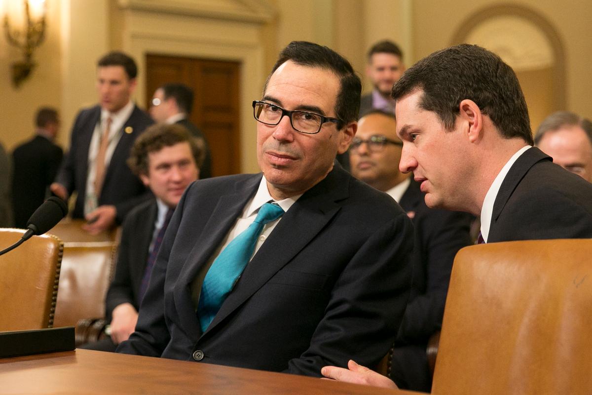 Secretary of the Treasury Steven Mnuchin (L) before he testifies at a congressional hearing on the president's fiscal year 2019 budget proposals in Washington on Feb. 15, 2018. (Samira Bouaou/The Epoch Times)