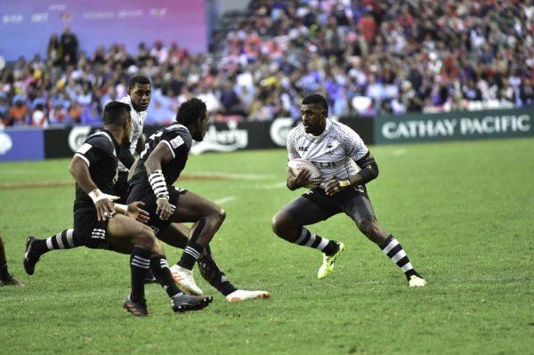 Fiji's Kalione Nasoko sizes up the New Zealand opposition before passing to score during their 50-7 points win, at the Hong Kong Sevens on Saturday April 7, 2018. (Bill Cox/Epoch Times)