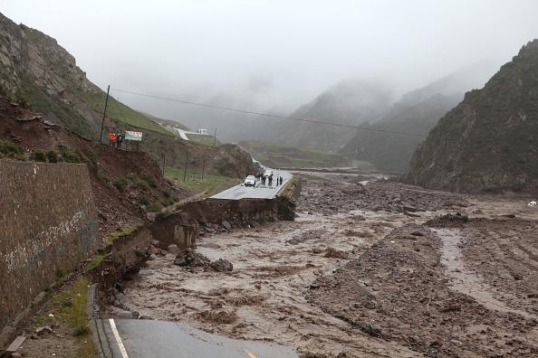 Middle section road of the China National Highway 227 collapses due to continuous heavy rainstorm on August 22, 2016 in Zhangye, Gansu Province of China. (Wang Jiang/VCG)
