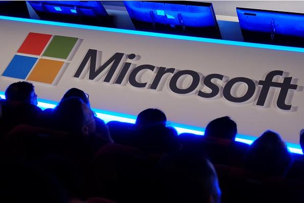 International buyers listen to a speech in front of a Microsoft logo during the Computex tech show in Taipei on June 4, 2014. (SAM YEH/AFP/Getty Images)