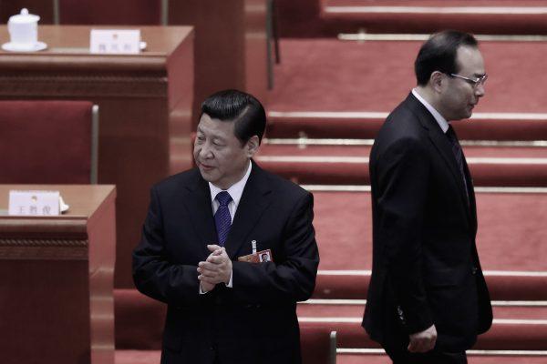 Former Chongqing party chief Sun Zhengcai (R) walks behind Chinese leader Xi Jinping as they attend a session of the rubber-stamp parliament, the National People's Congress, at the Great Hall of the People in Beijing on March 15, 2013. (Feng Li/Getty Images)