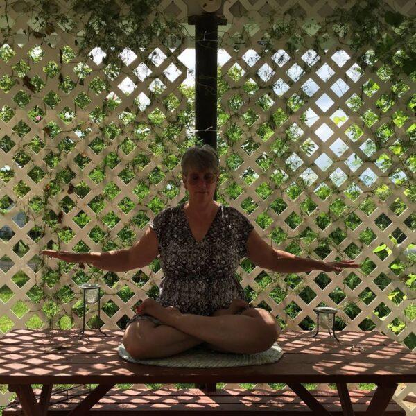 Barbara Gay performing one of Falun Dafa's meditative exercises in a recent photo.