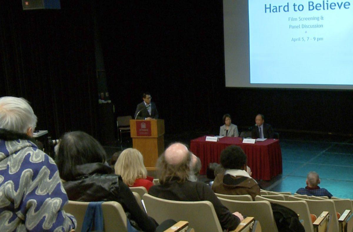 Panellists Maria Cheung, an assistant professor and a research affiliate with the Centre for Human Rights Research at the University of Manitoba, and Xun Li, president of the Falun Dafa Association of Canada, at a panel discussion moderated by University of Ottawa law professor Y. Y. Chen following a screening of the documentary “Hard to Believe” at the University of Ottawa on April 5, 2018. (Jian Ren/The Epoch Times)