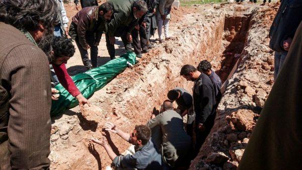 Syrians dig a grave to bury the bodies of victims of a a suspected toxic gas attack in Khan Sheikhun, a nearby rebel-held town in Syrias northwestern Idlib province, on April 5, 2017. (Fadi Al-Halabi/AFP/Getty Images)
