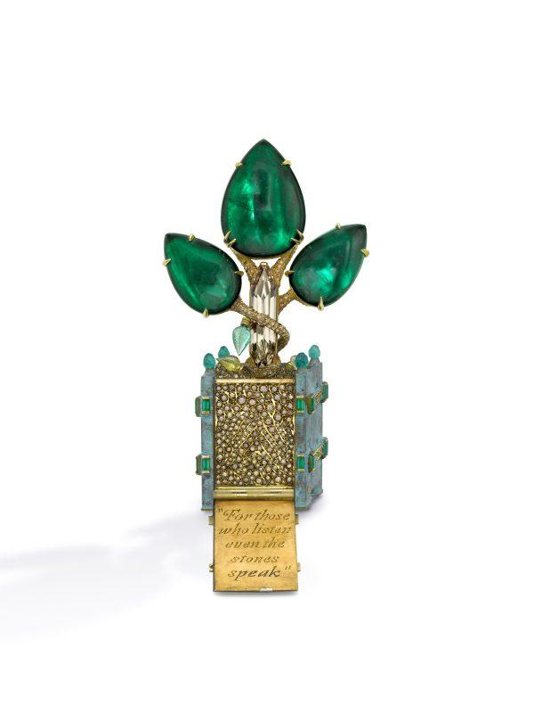 "The Emerald Tree" designed by H.R.H. Prince Dimitri of Yugoslavia was inspired by the wooden cachepots in the Orangerie at Versailles. The center stone is a cabochon emerald of 35 carats flanked by two cabochon emeralds of 27 carats each. The trunk of the tree is a long cognac diamond. (Benjamin Chasteen/The Epoch Times)
