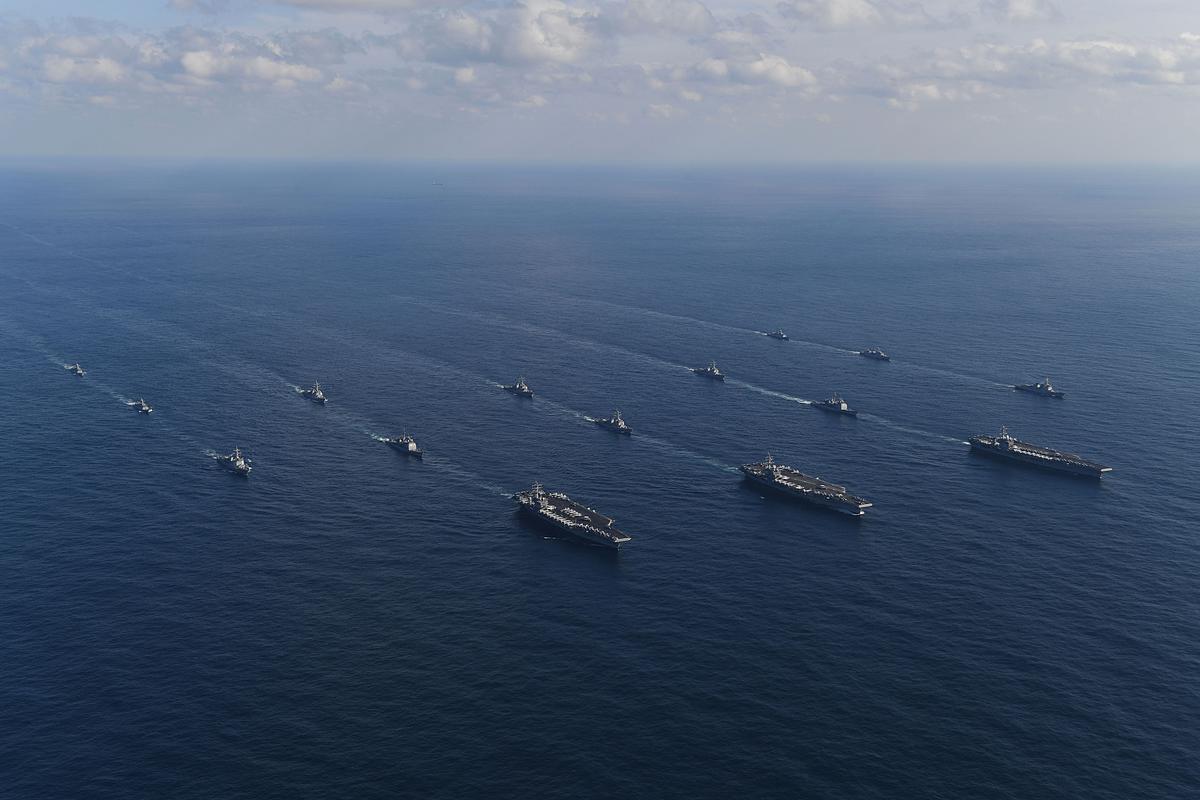 In this handout image released September 13 by South Korean Defense Ministry, USS Nimitz (L), USS Ronald Reagan (C) and USS Theodore Roosevelt (R) conducting operations with South Korea's destroyers during a joint naval drill in East Sea, South Korea, on Nov. 12, 2017. (South Korean Defense Ministry via Getty Images)