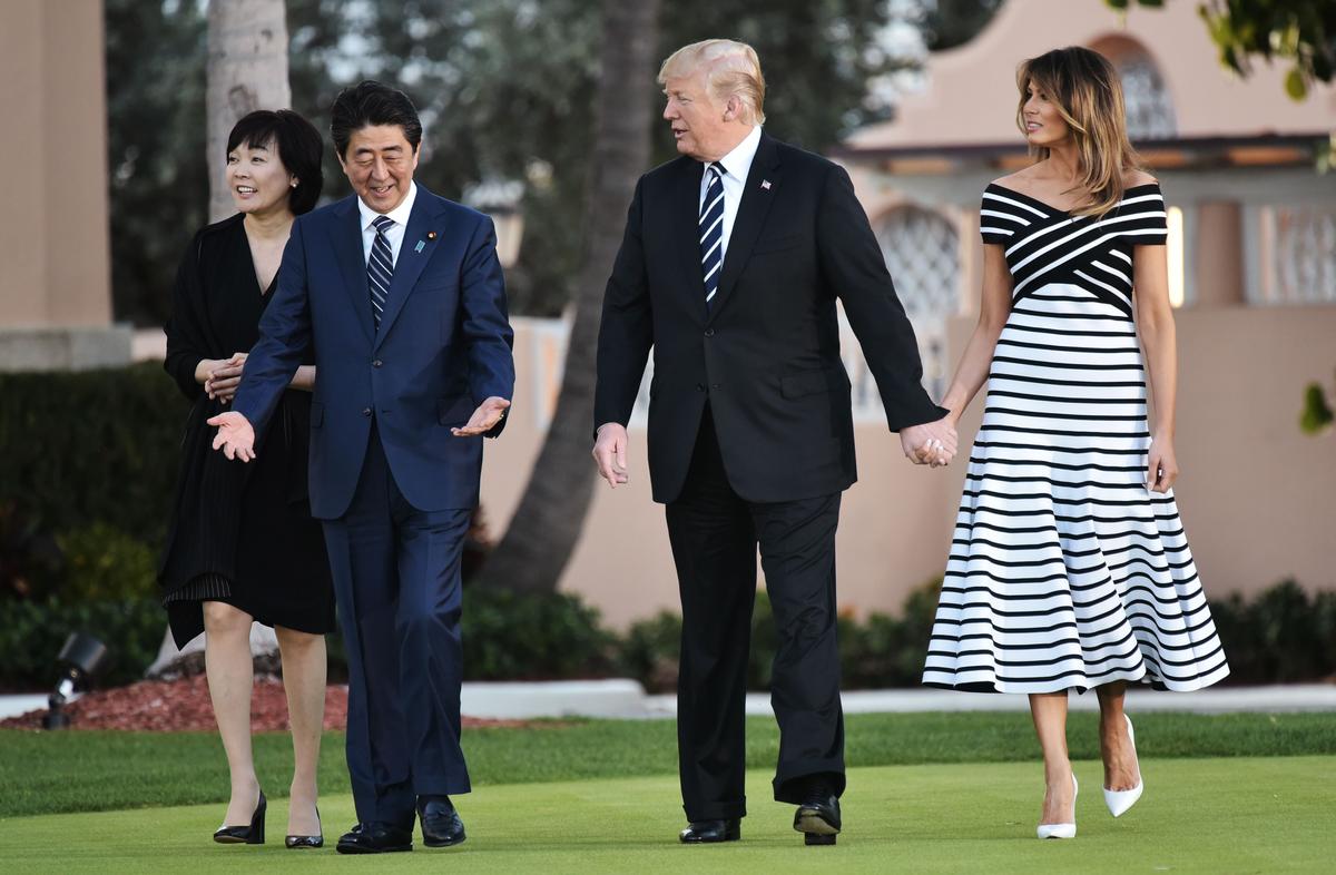 President Donald Trump and First Lady Melania Trump walk with Japan's Prime Minister Shinzo Abe and wife Akie Abe as they arrive for dinner at Trump's Mar-a-Lago resort in Palm Beach, Florida on April 17, 2018. (MANDEL NGAN/AFP/Getty Images)