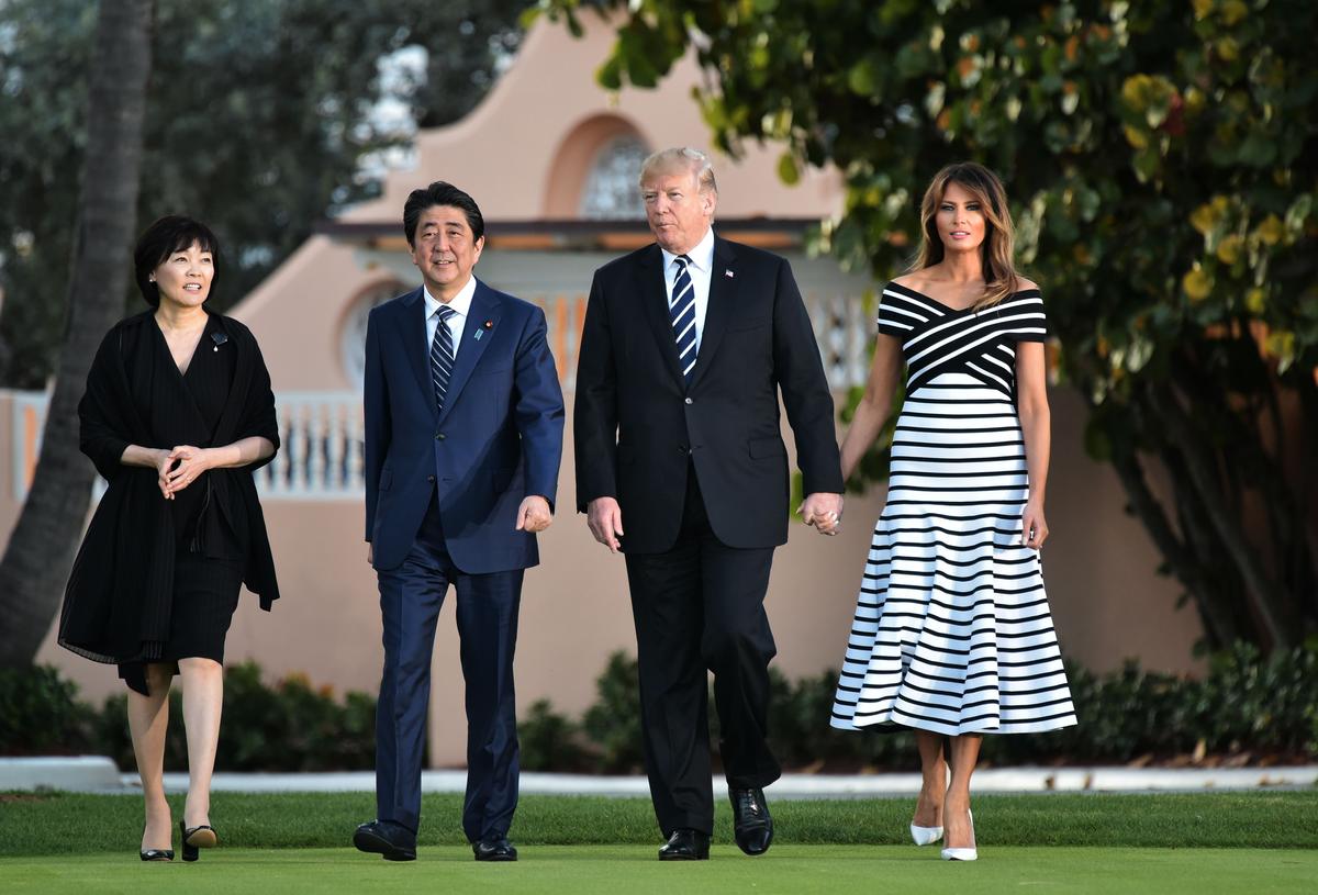 US President Donald Trump and First Lady Melania Trump walk with Japan's Prime Minister Shinzo Abe and his wife Akie Abe as they arrive for dinner at Trump's Mar-a-Lago resort in Palm Beach, Florida on April 17, 2018. (Mandel Ngan/AFP/Getty Images)