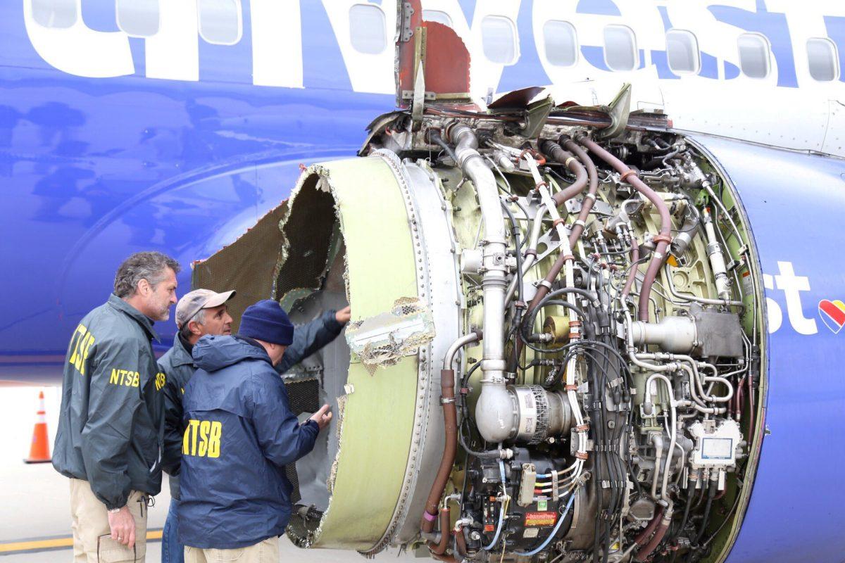 A U.S. NTSB investigator is on scene examining damage to the engine of the Southwest Airlines plane in this image released from Philadelphia, Pennsylvania on April 17, 2018. (NTSB/Handout via Reuters)